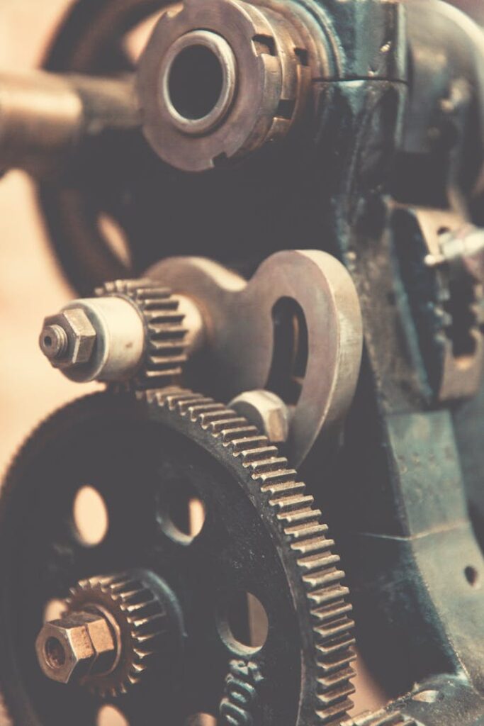 pexels photo 239419 Detailed view of vintage industrial machinery gears showcasing precision engineering.