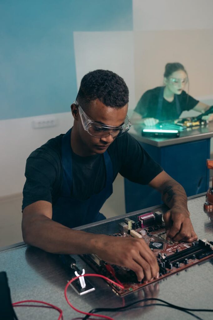 pexels photo 9242262 Engineer assembling and testing electronic hardware in a lab environment.